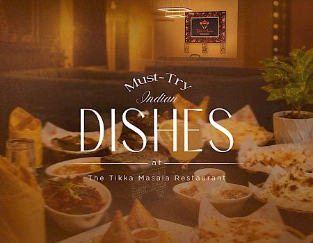 A warm buffet scene promoting must-try Indian dishes at The Tikka Masala Restaurant.